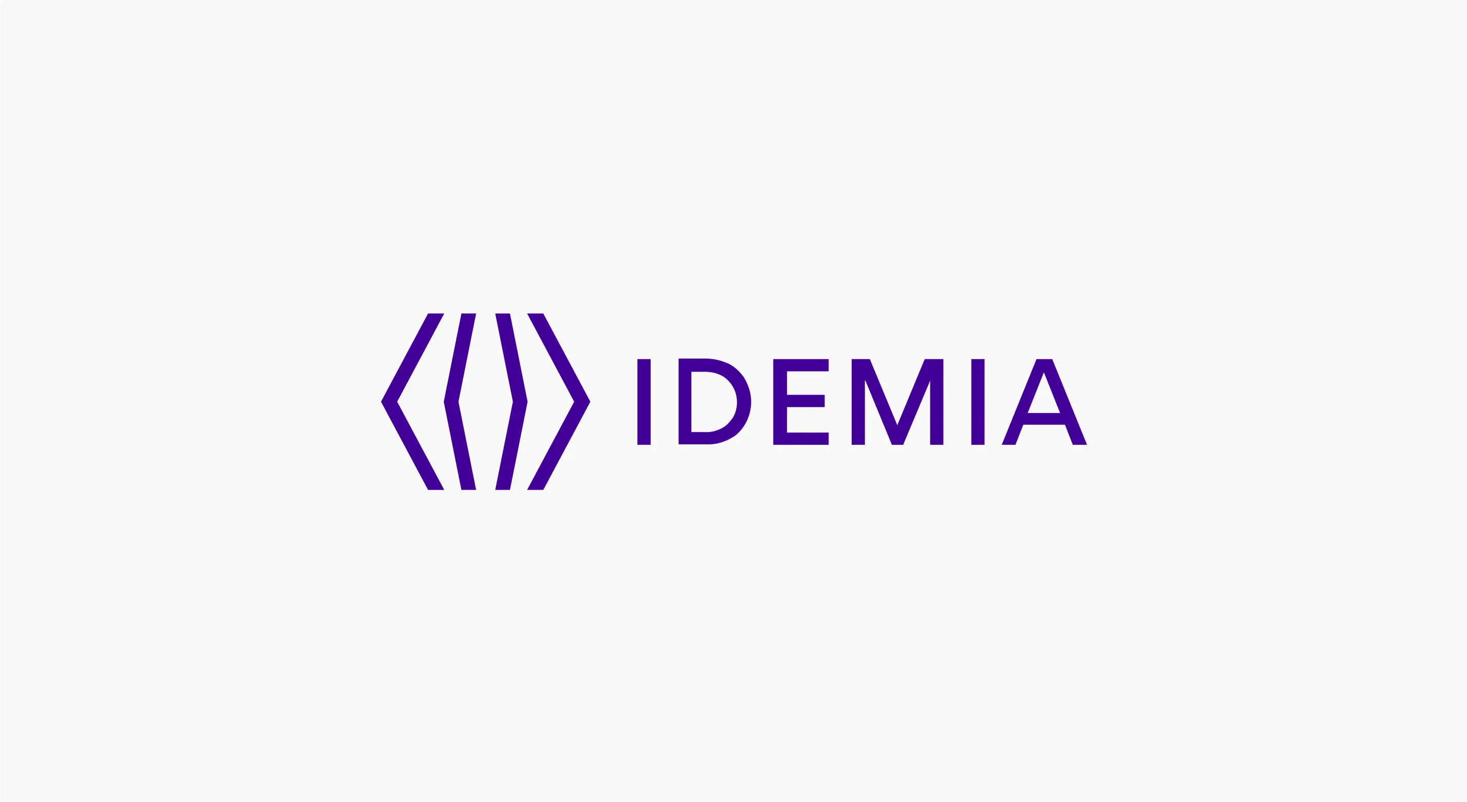 a purple logo for idemia on a white background